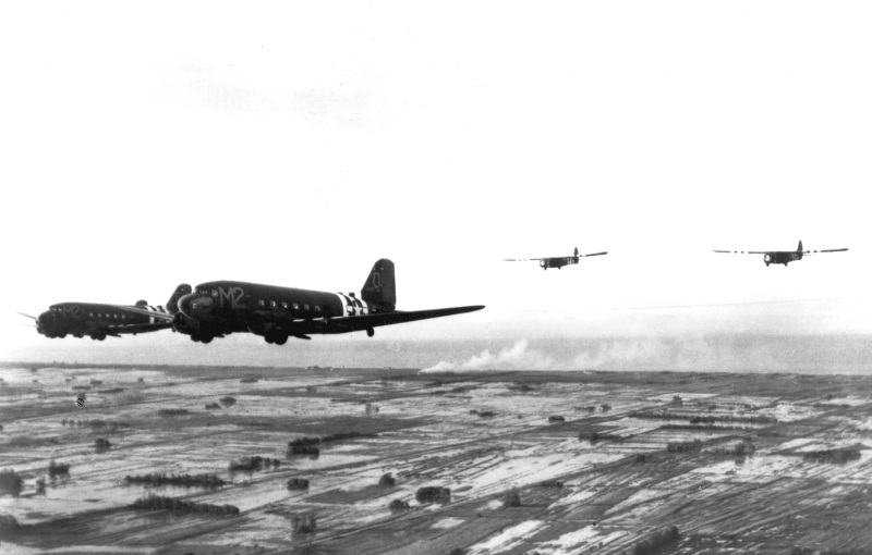 C-47As_of_88th_TCS_tow_gliders_over_Normandy_in_June_1944